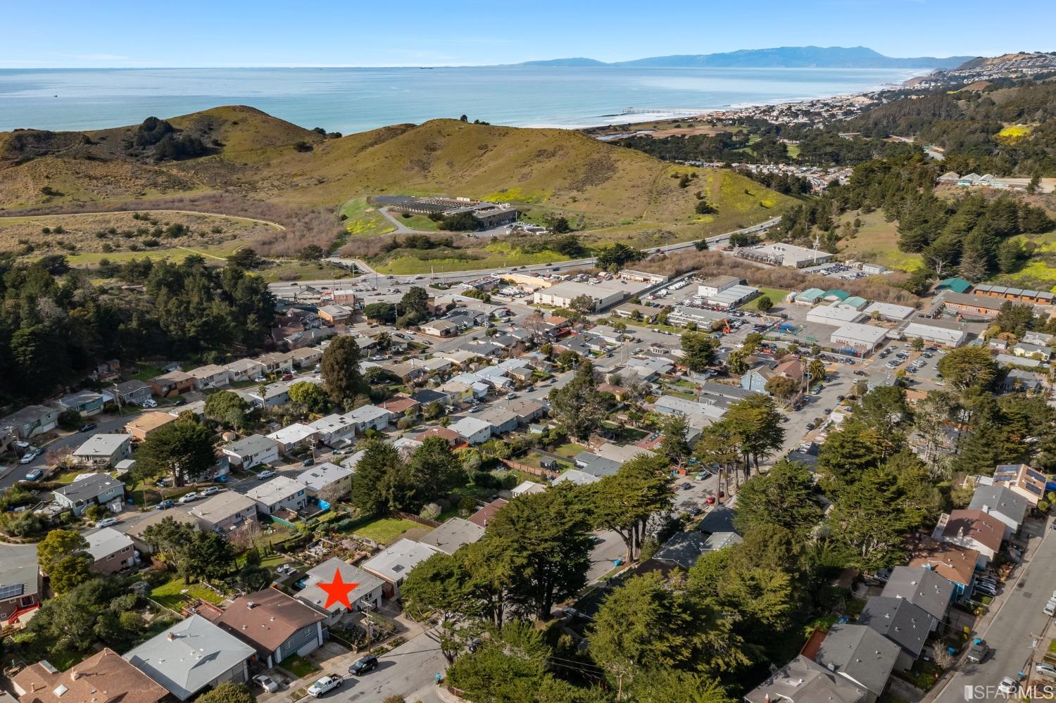 296 Reichling Avenue Pacifica, CA 94044 - Photo 37 of 39 a view of a city with mountains in the background
