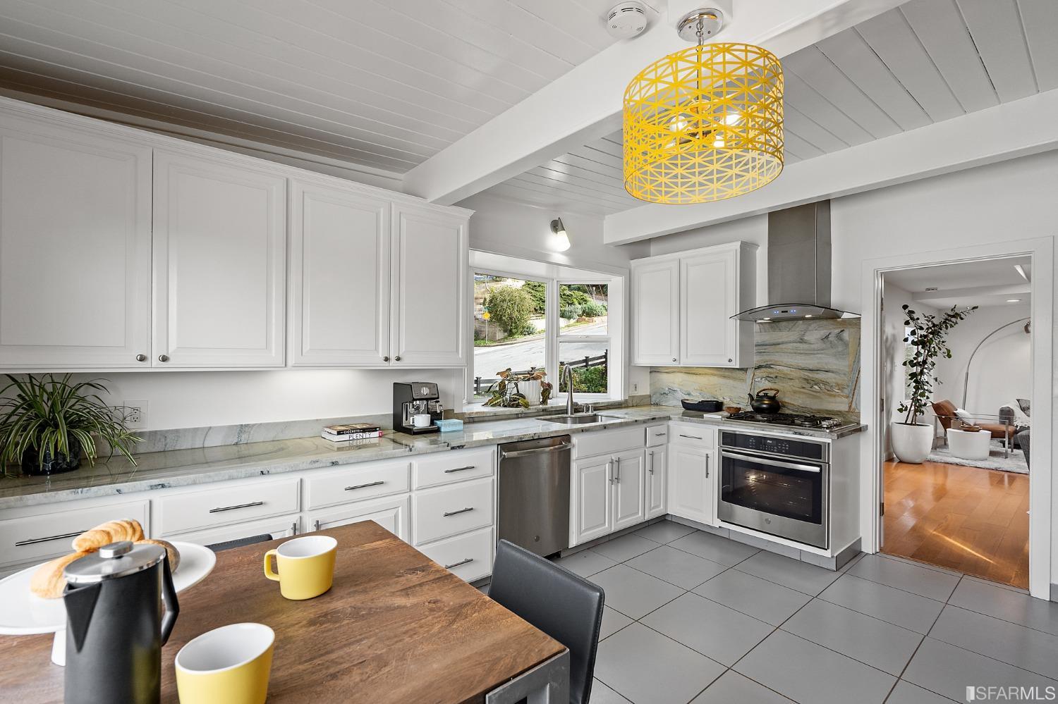 296 Reichling Avenue Pacifica, CA 94044 - Photo 8 of 39 a kitchen with stainless steel appliances granite countertop a stove sink and cabinets