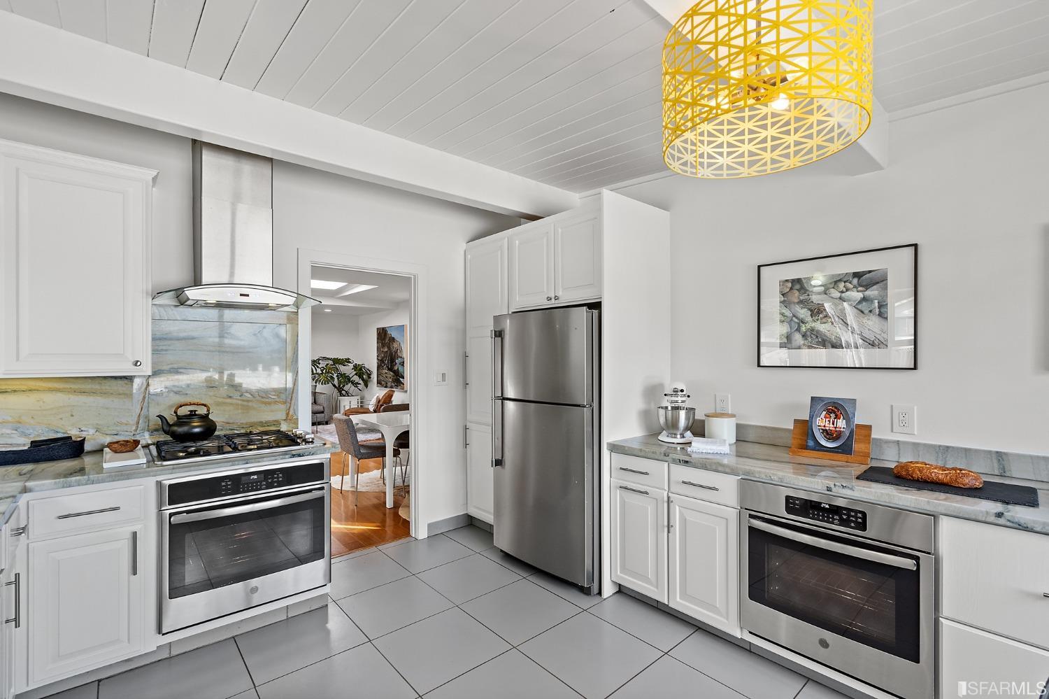 296 Reichling Avenue Pacifica, CA 94044 - Photo 9 of 39 a kitchen with stainless steel appliances a stove a refrigerator and a sink