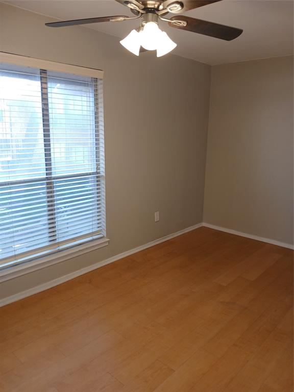 10536 Stone Canyon Road, Unit 216 Dallas, TX 75230 - Photo 14 of 19 an empty room with a window