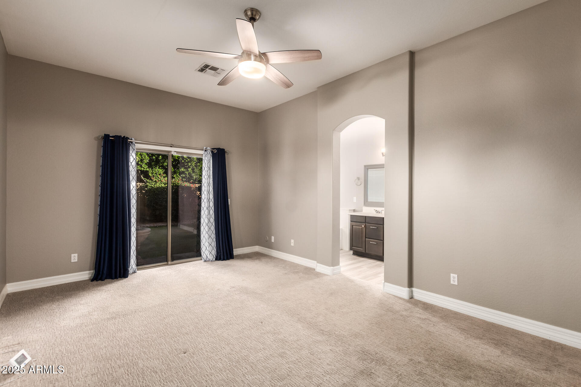 16607 North 50th Way Scottsdale, AZ 85254 - Photo 12 of 24 a view of a livingroom with a ceiling fan and window