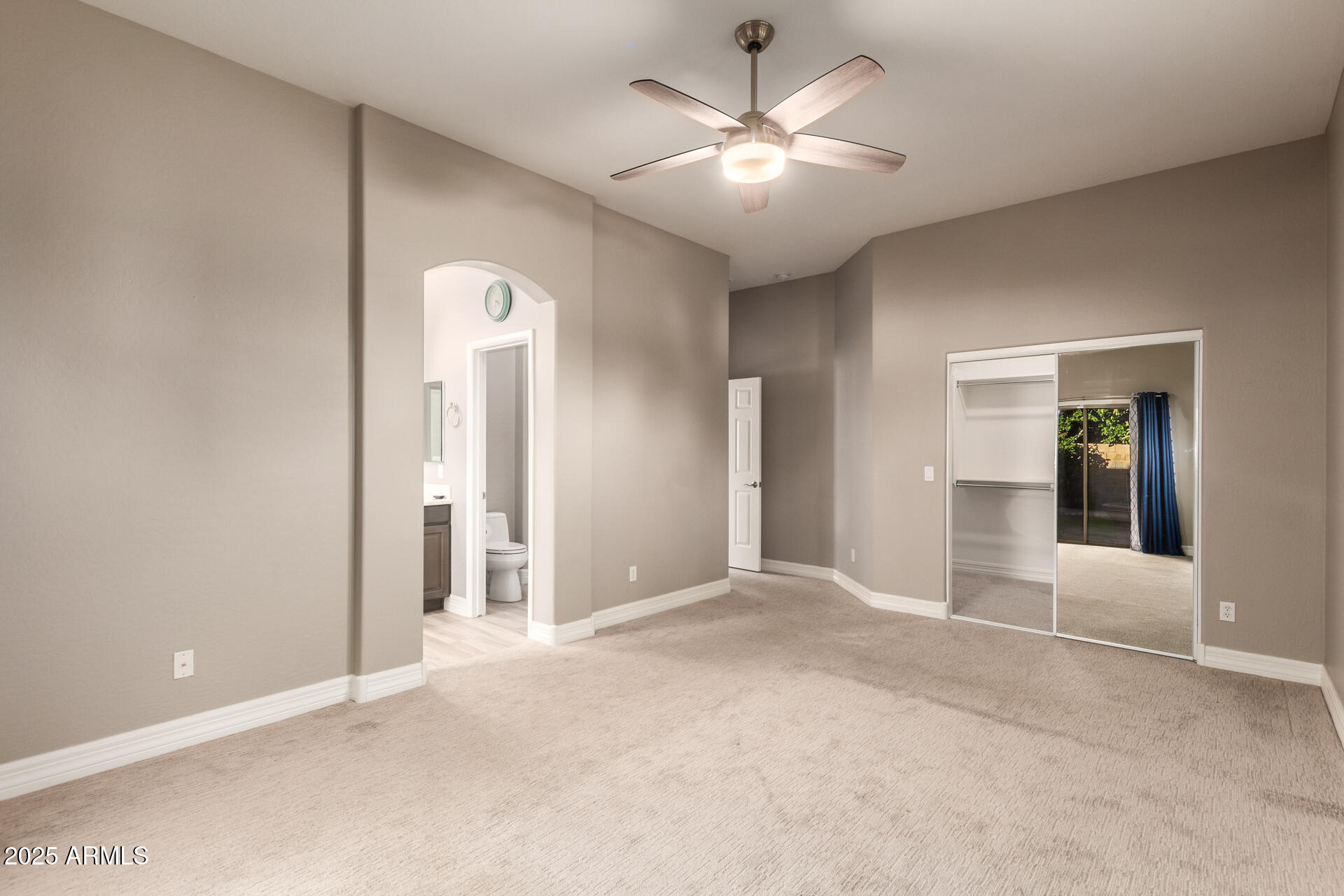 16607 North 50th Way Scottsdale, AZ 85254 - Photo 13 of 24 an empty room with fan and entrance