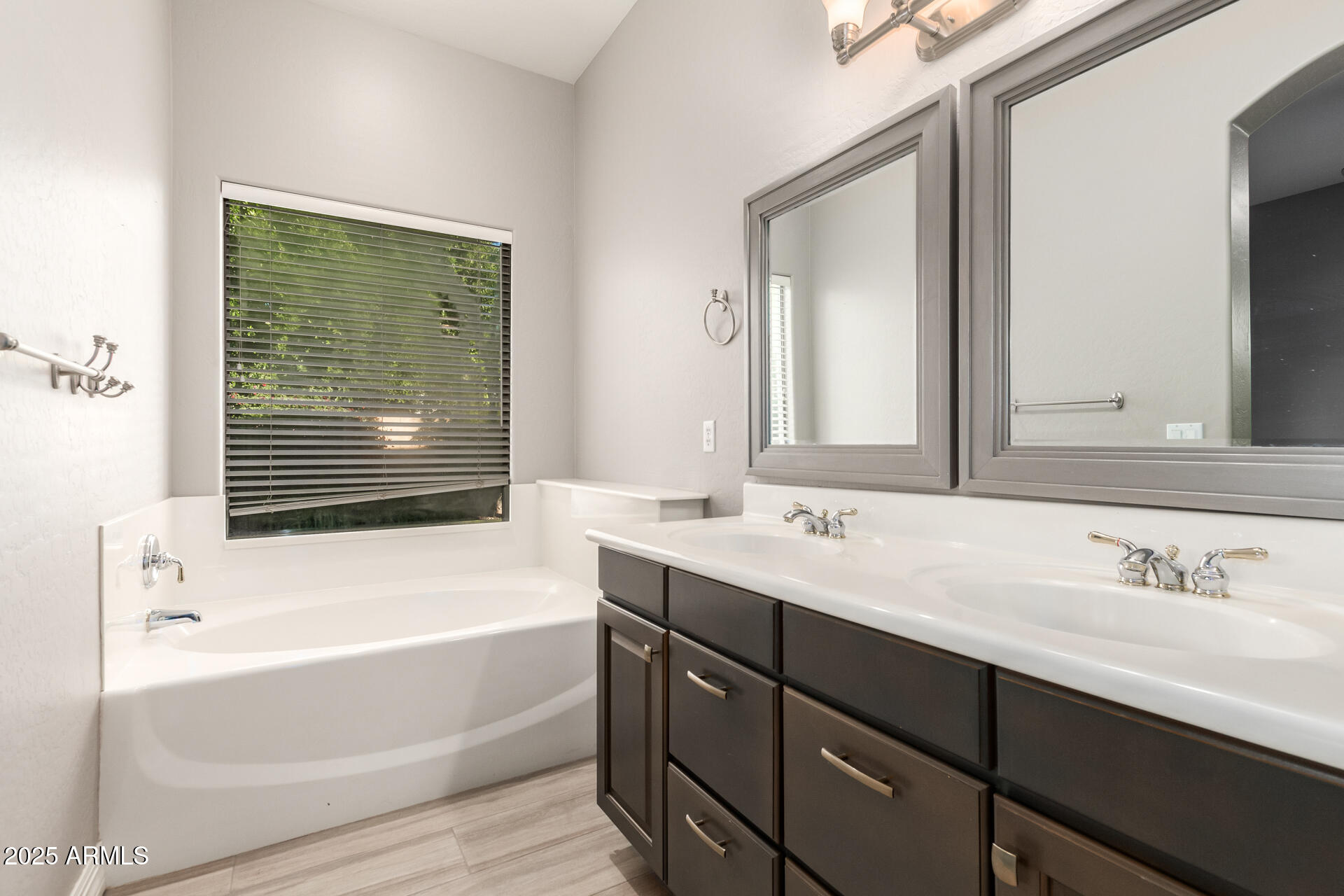 16607 North 50th Way Scottsdale, AZ 85254 - Photo 15 of 24 a bathroom with a tub sink and mirror