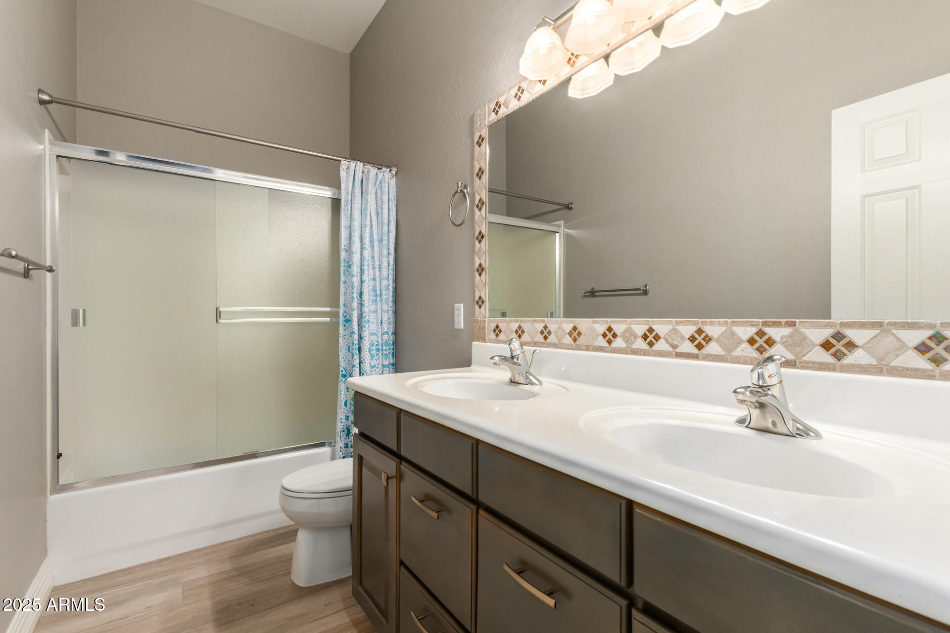 16607 North 50th Way Scottsdale, AZ 85254 - Photo 19 of 24 a bathroom with a sink a toilet and shower