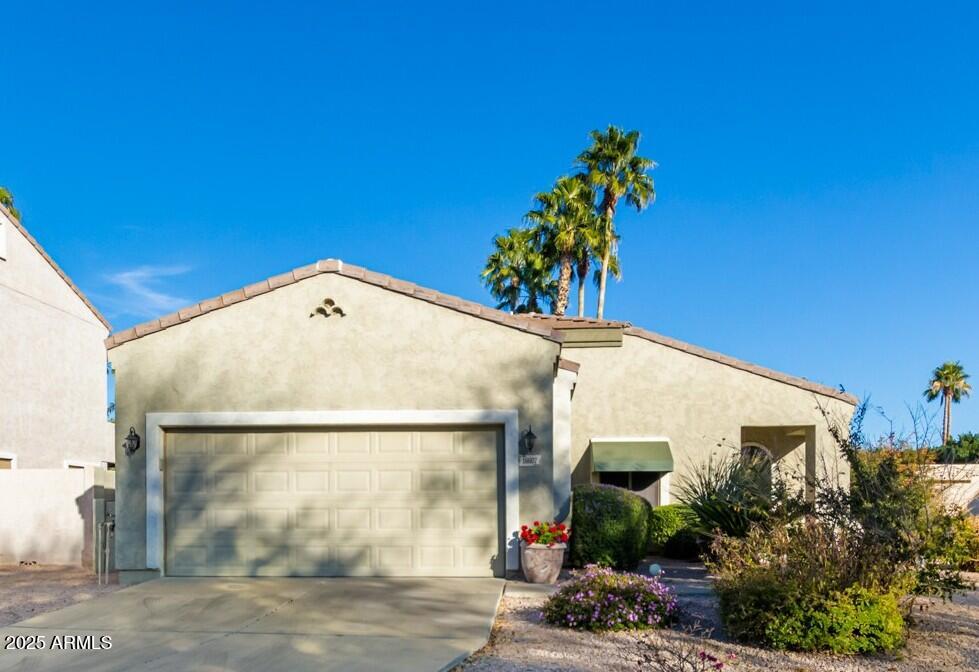 16607 North 50th Way Scottsdale, AZ 85254 - Photo 2 of 24 a view of a house with a potted plant