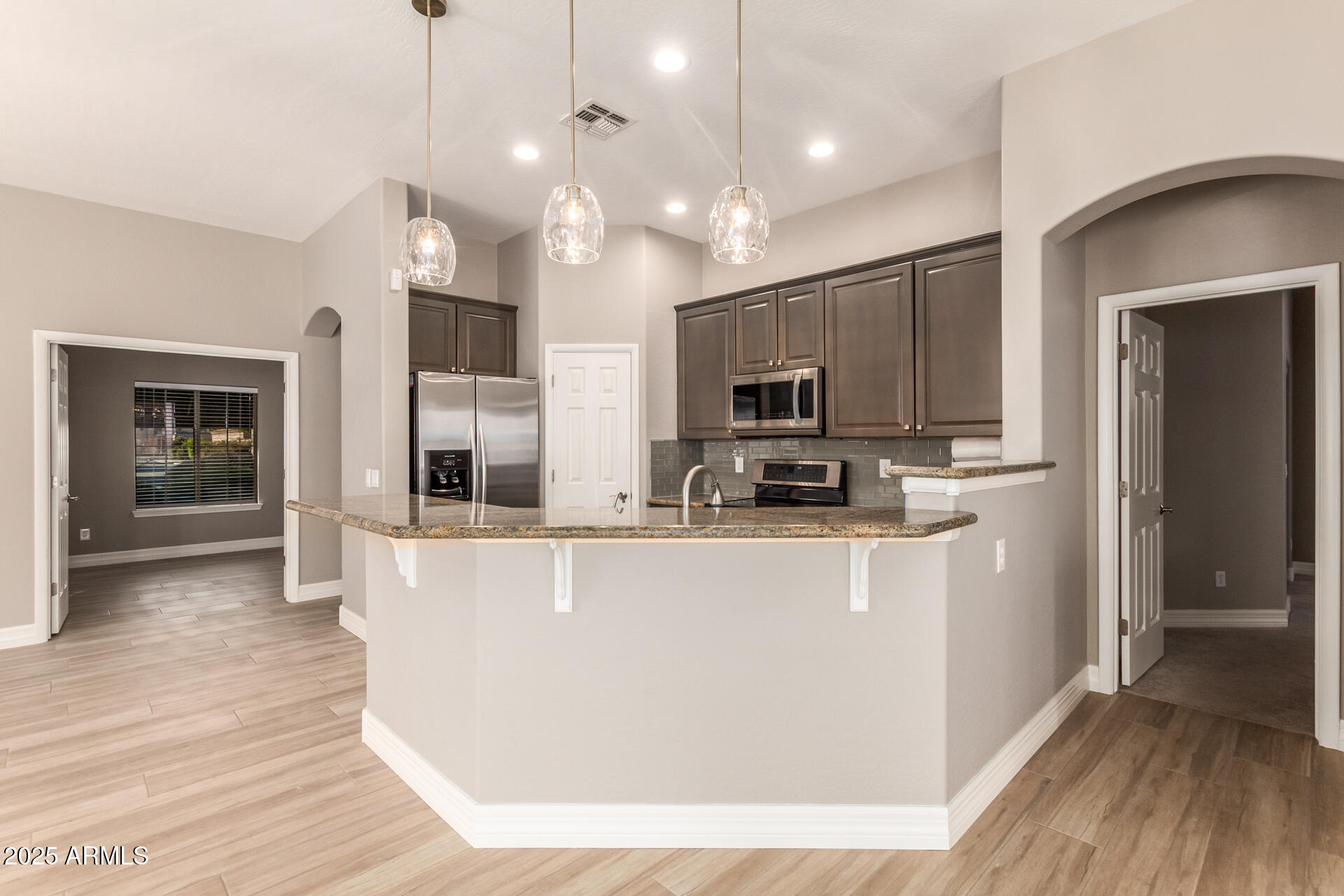 16607 North 50th Way Scottsdale, AZ 85254 - Photo 8 of 24 a view of a kitchen with microwave and cabinets