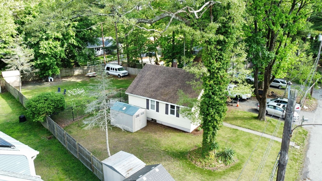 32 Birch Road Natick, MA 01760 - Photo 12 of 38 a view of yard with swimming pool and trees in the background