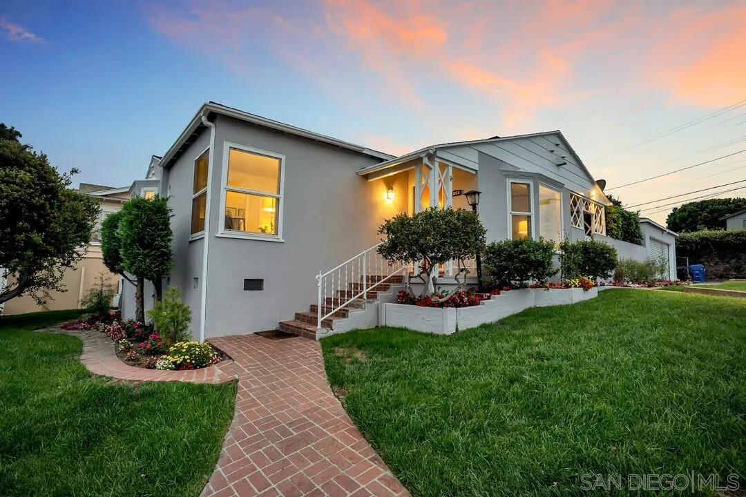 7501 Earldom Avenue Playa del Rey, CA 90293 - Photo 6 of 12 a front view of a house with a yard and potted plants