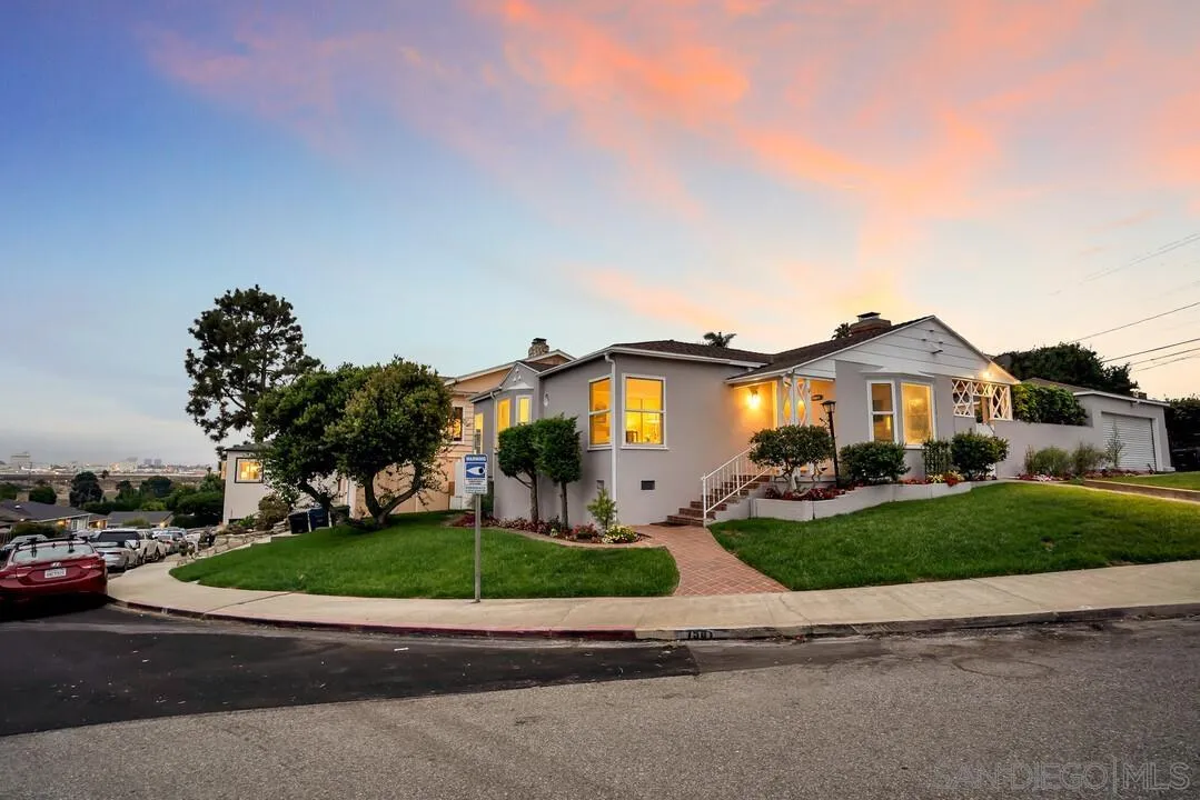 7501 Earldom Avenue Playa del Rey, CA 90293 - Photo 7 of 12 a front view of a house with a yard and garage