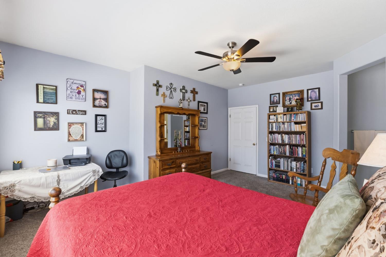 1757 Homestead Way Lemoore, CA 93245 - Photo 14 of 35 a bedroom with a bed furniture and a chandelier