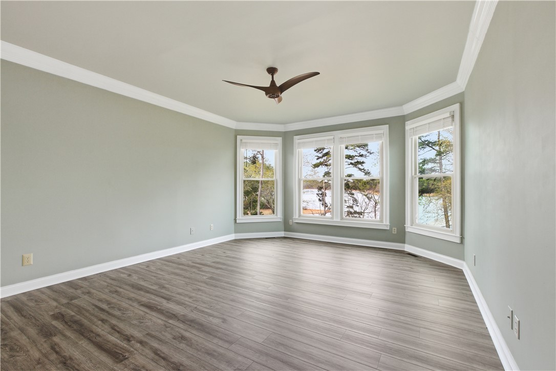 501 Capri Point Lavonia, GA 30553 - Photo 10 of 50 This bright bedroom offers expansive views and beautiful flooring, creating a serene personal retreat.