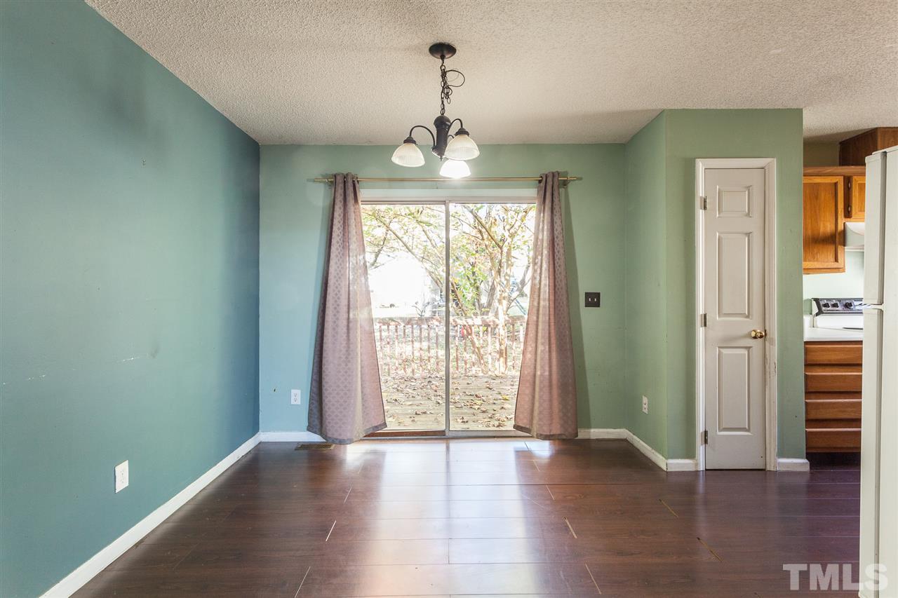 2309 Havering Place Raleigh, NC 27604 - Photo 13 of 23 wooden floor in an empty room with a window