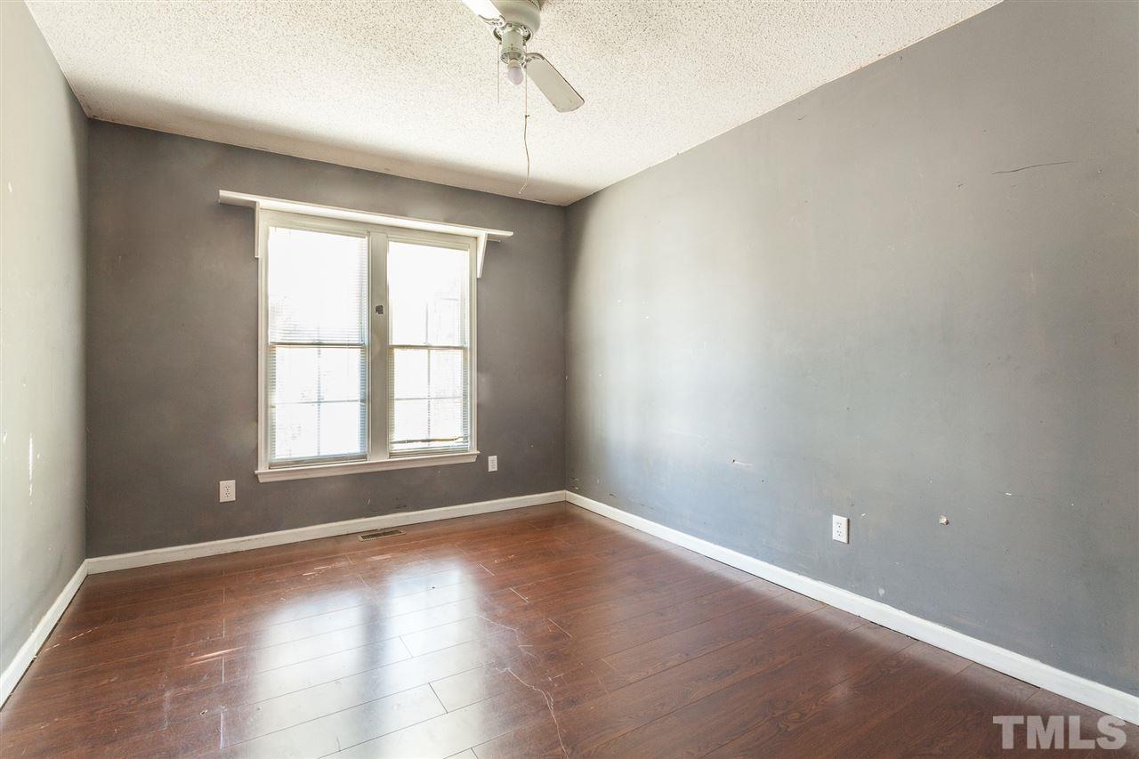2309 Havering Place Raleigh, NC 27604 - Photo 21 of 23 an empty room with wooden floor and windows