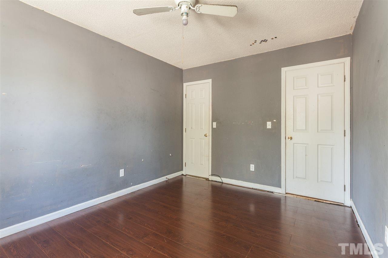 2309 Havering Place Raleigh, NC 27604 - Photo 22 of 23 wooden floor in an empty room with a window