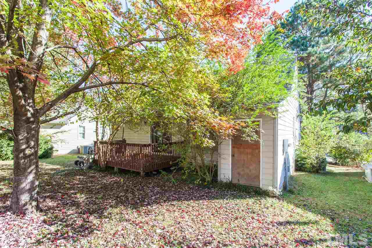 2309 Havering Place Raleigh, NC 27604 - Photo 6 of 23 a backyard of a house with lots of green space