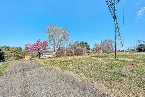 a bathroom with a tub and a window
