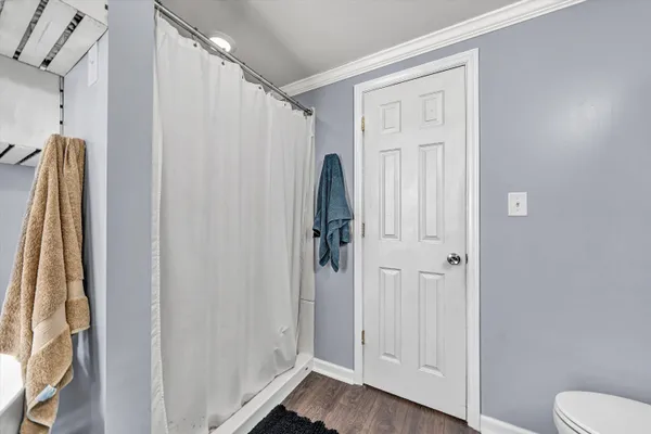 a view of a balcony with wooden floor and city view