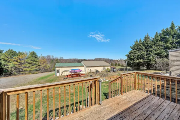 a living room with lots of furniture and a chandelier