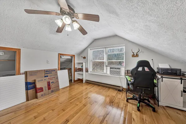 a view of an entryway with wooden floor