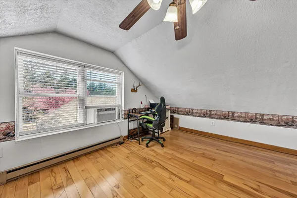 a bathroom with a toilet a sink and a mirror