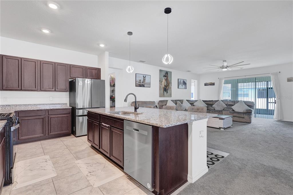 7185 Southwest 63rd Street Ocala, FL 34474 - Photo 12 of 31 a large kitchen with lots of counter space and sink