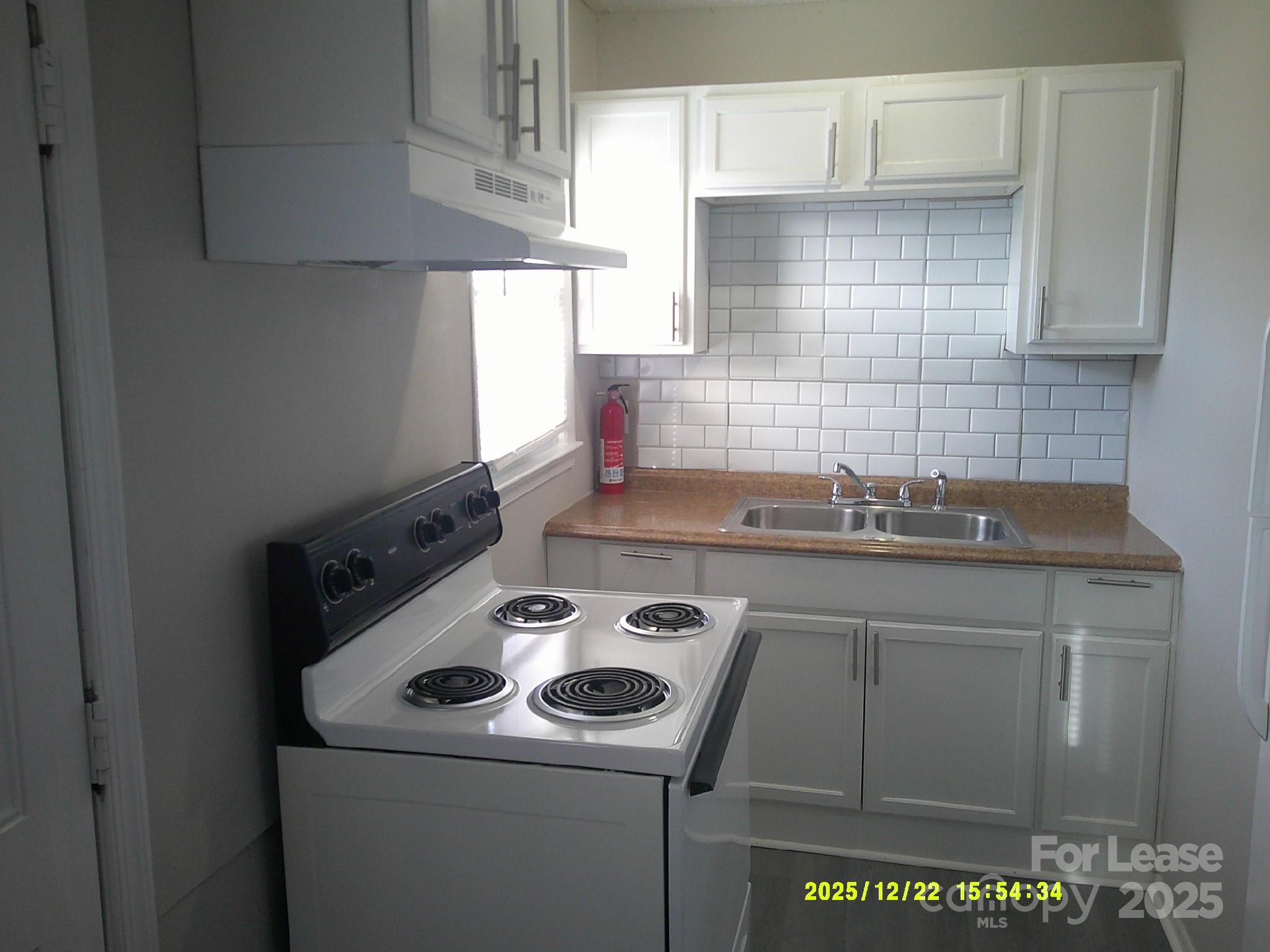 1219 County Home Road Conover, NC 28613 - Photo 2 of 6 a kitchen with a sink cabinets and appliances