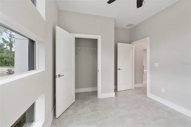 a view of an empty room and a window