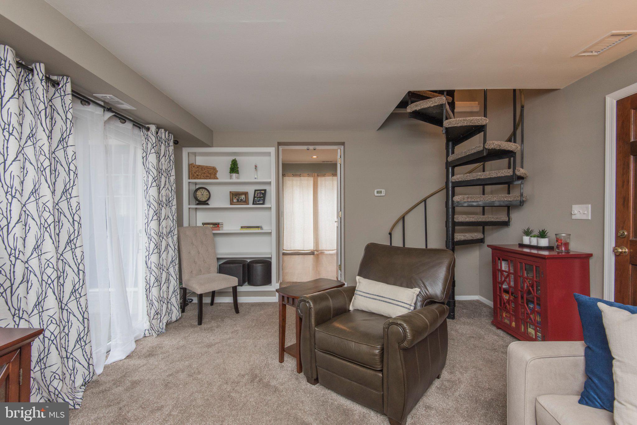 650 North Valley Forge Road Devon, PA 19333 - Photo 8 of 38 Charming living space with spiral stairs.