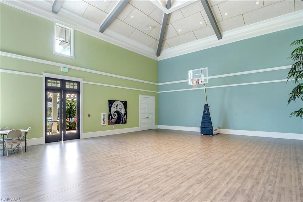 5782 Highbourne Drive Naples, FL 34113 - Photo 29 of 31 a view of empty room with wooden floor