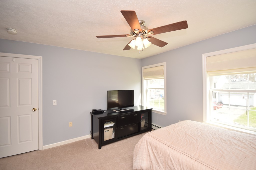 142 Benz Street Springfield, MA 01118 - Photo 24 of 30 a bedroom with a bed and a flat screen tv