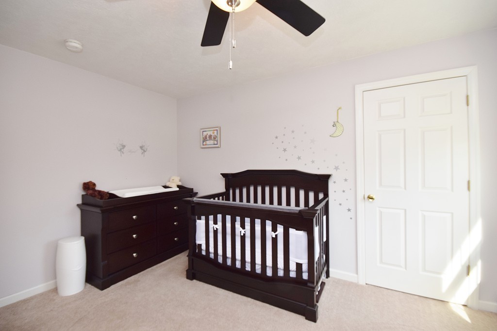 142 Benz Street Springfield, MA 01118 - Photo 25 of 30 a bedroom with a bed and cabinets
