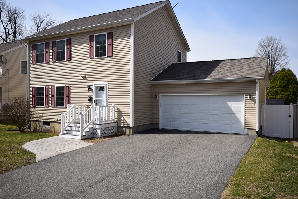 142 Benz Street Springfield, MA 01118 - Photo 30 of 30 a view of a house with garage and yard