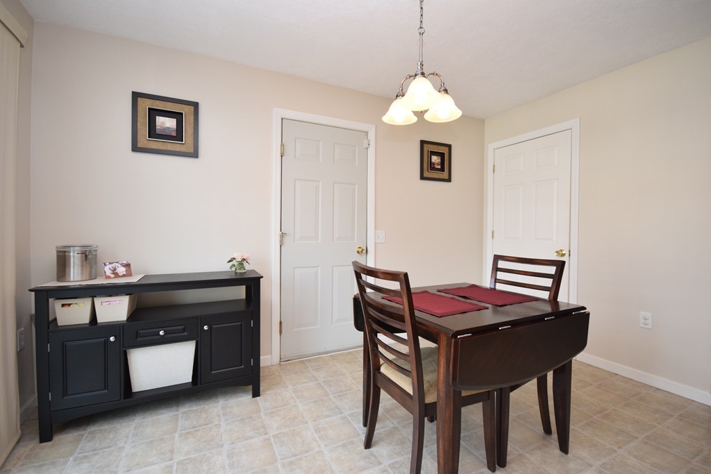 142 Benz Street Springfield, MA 01118 - Photo 4 of 30 a dining room with a table and chairs