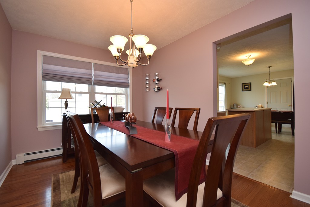 142 Benz Street Springfield, MA 01118 - Photo 5 of 30 a view of a dining room with furniture wooden floor and chandelier