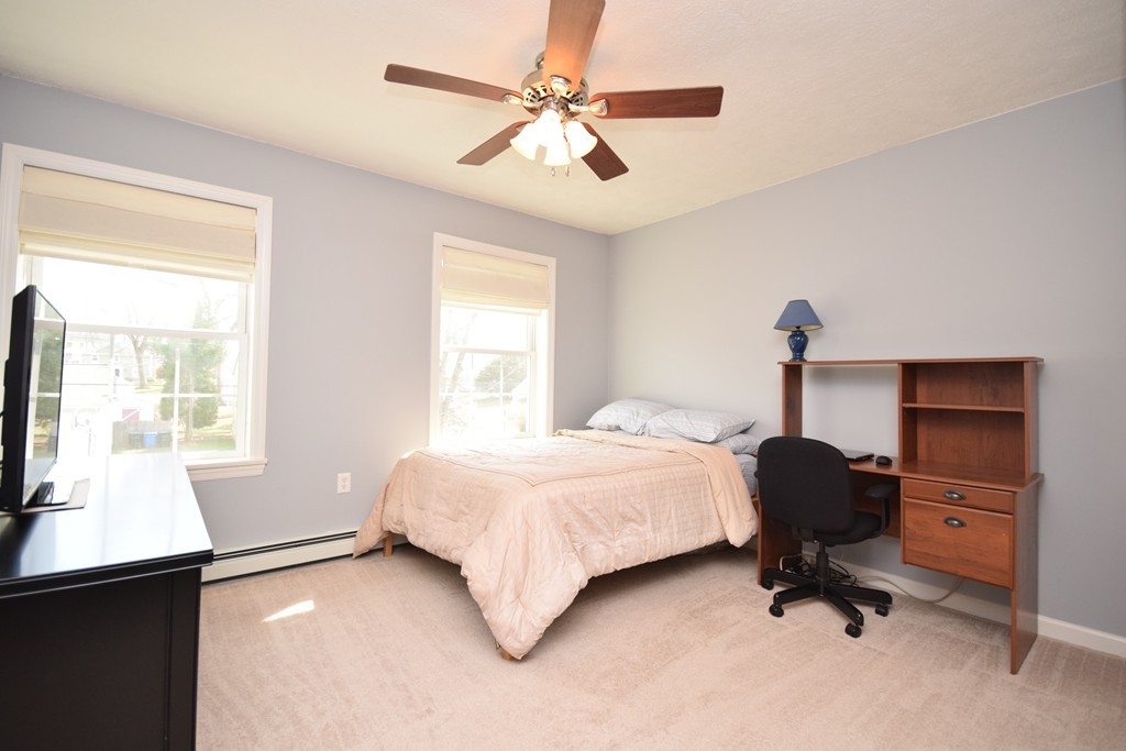 142 Benz Street Springfield, MA 01118 - Photo 9 of 30 a bedroom with a bed and a window