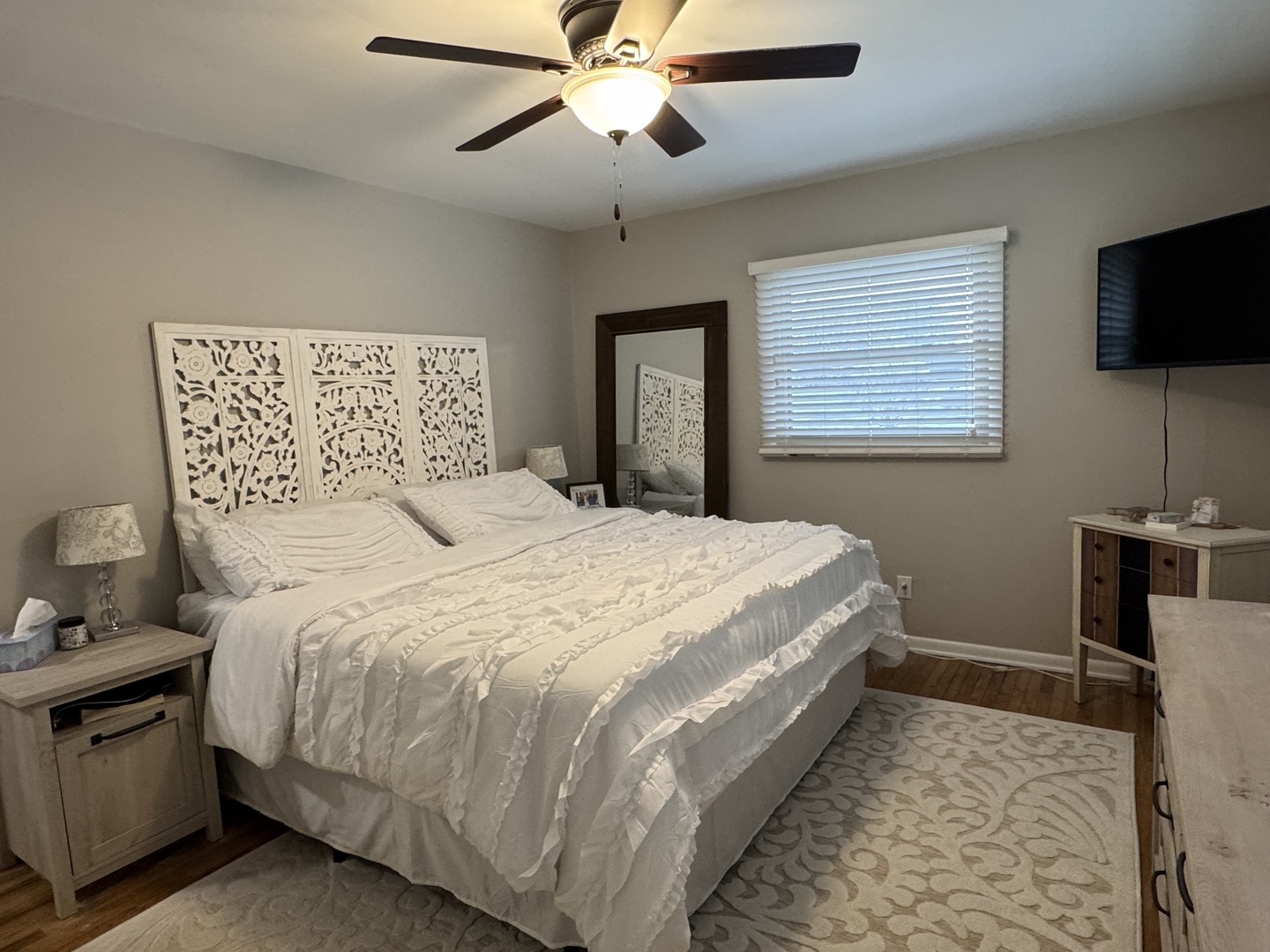 602 North Maple Street Herscher, IL 60941 - Photo 17 of 26 a bedroom with a bed and a flat screen tv