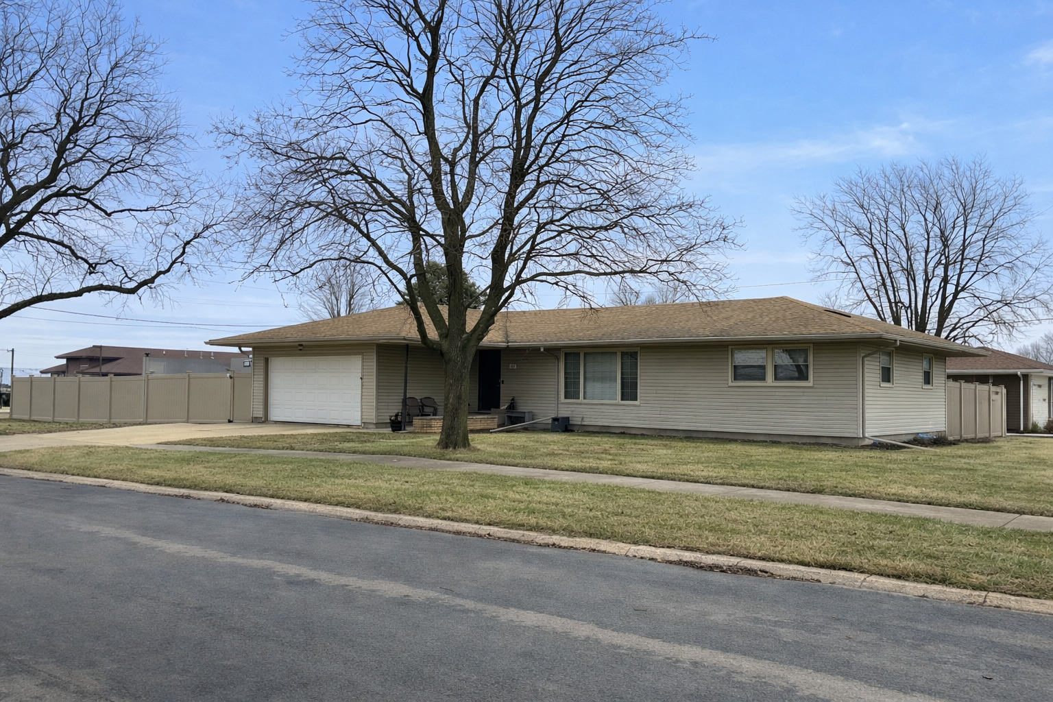 602 North Maple Street Herscher, IL 60941 - Photo 2 of 26 a house that has a tree in front of it