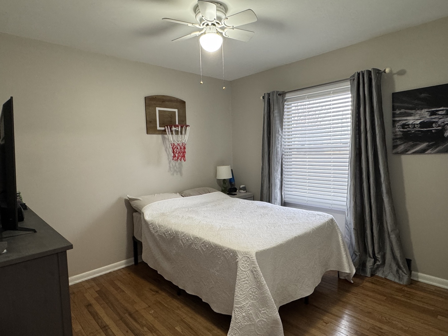 602 North Maple Street Herscher, IL 60941 - Photo 21 of 26 a bedroom with a bed and a flat screen tv