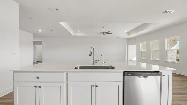 a bathroom with a sink vanity and a mirror