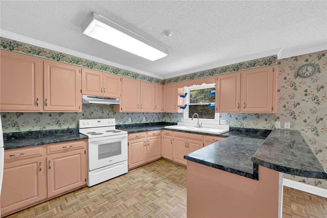1016 Campbell Road Belton, SC 29627 - Photo 11 of 50 A classic kitchen with ample counter space and a convenient breakfast bar awaits culinary adventures.
