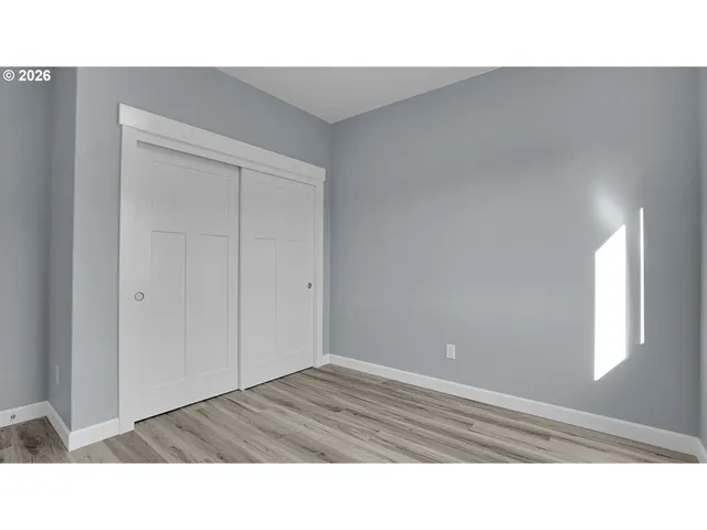 a black and white photo of a bedroom