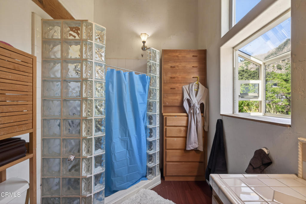 8416 Wheeler Canyon Road Santa Paula, CA 93060 - Photo 21 of 48 a view of walk in closet with clothes and shoes