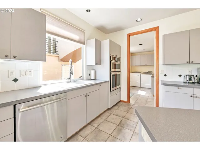 a view of a bedroom with wooden floor