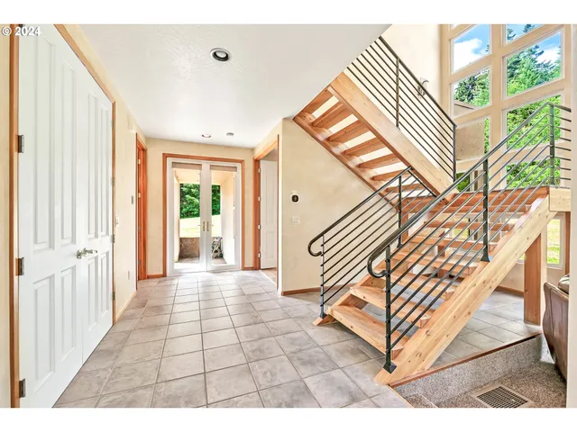 a view of an entryway with a front door