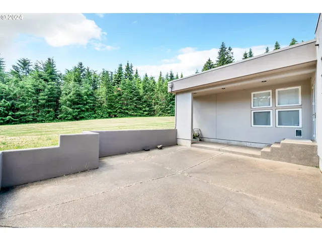 a view of a room with wooden walls