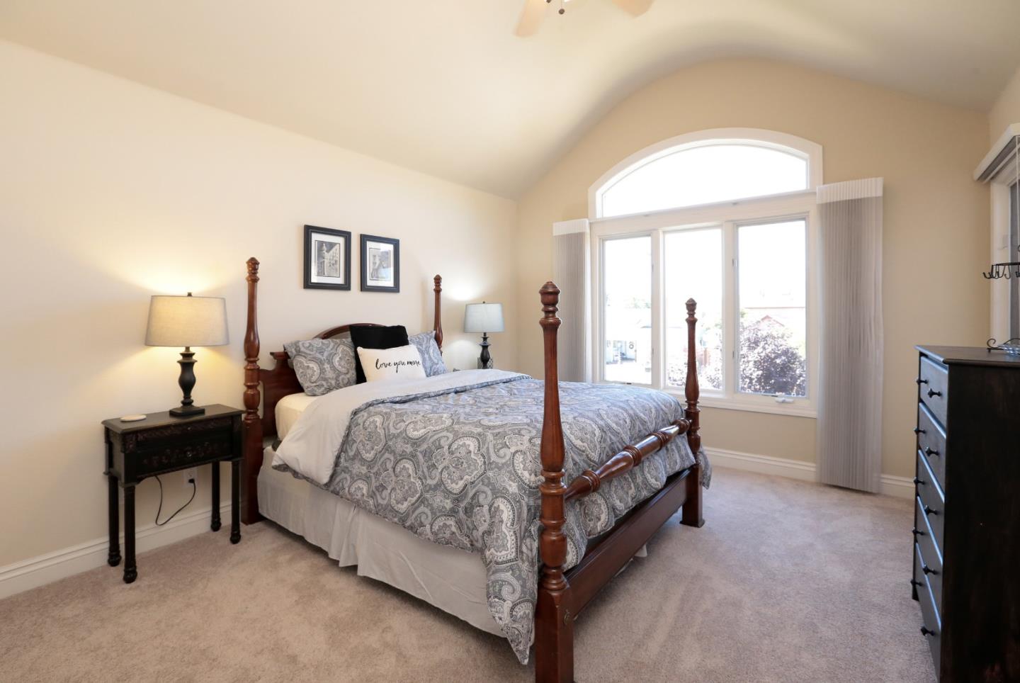 1068 Audrey Avenue Campbell, CA 95008 - Photo 22 of 47 a spacious bedroom with a bed and a window