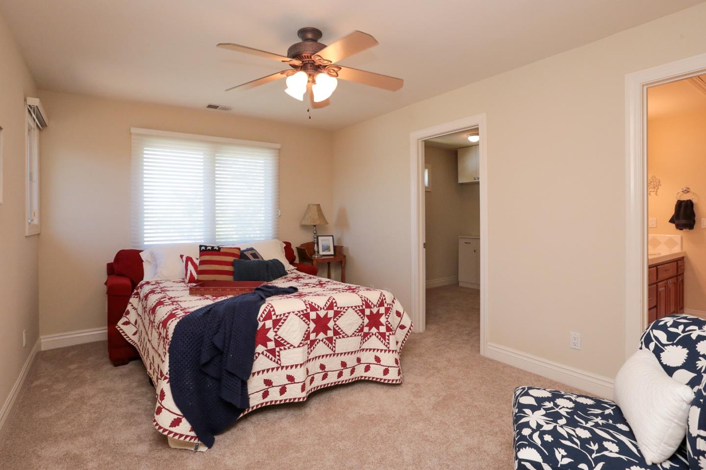 1068 Audrey Avenue Campbell, CA 95008 - Photo 23 of 47 a bedroom with a bed and a chandelier