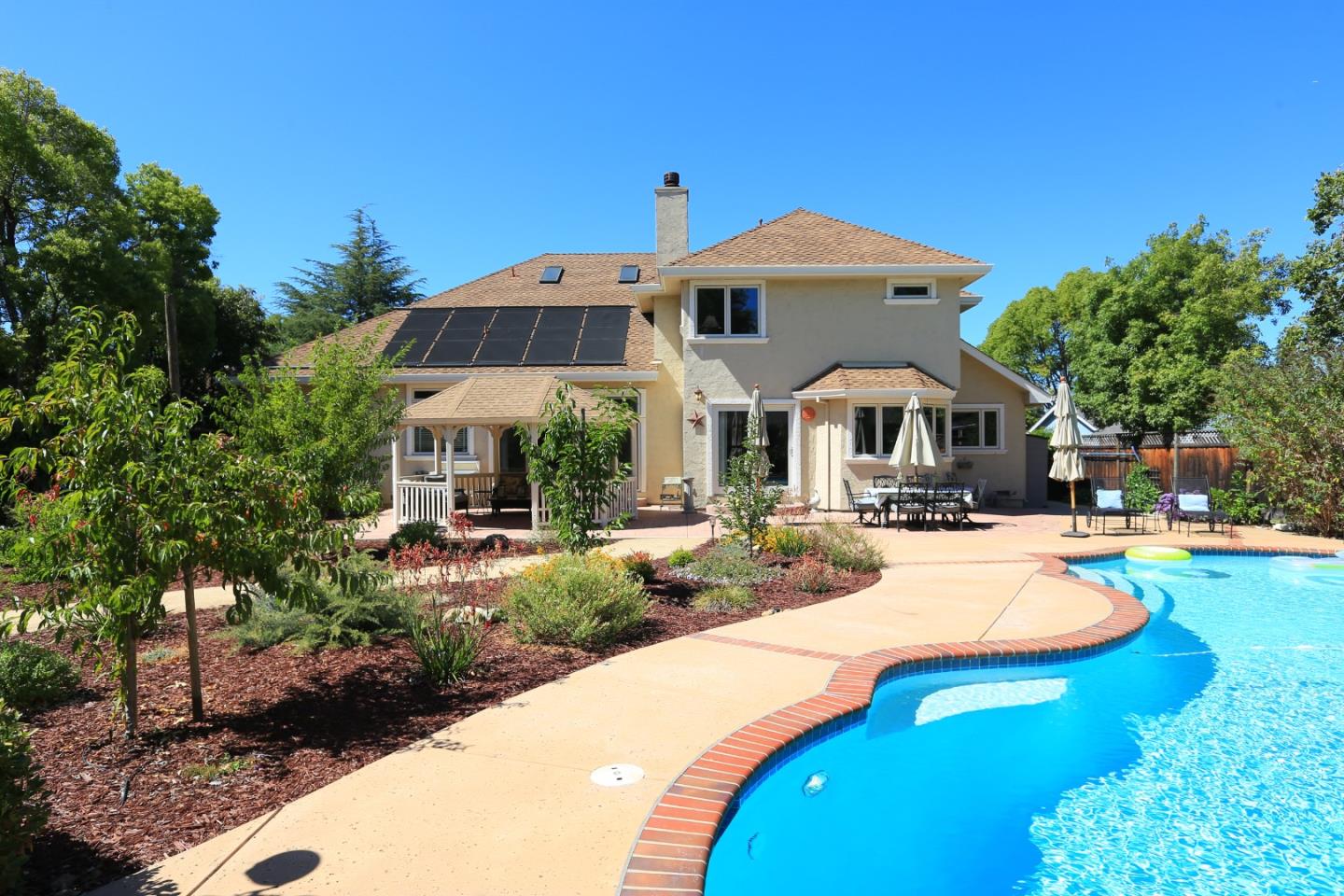 1068 Audrey Avenue Campbell, CA 95008 - Photo 29 of 47 a front view of a house with swimming pool yard and outdoor seating