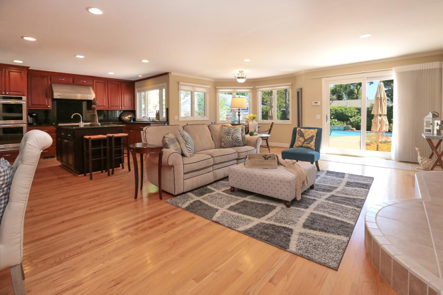 1068 Audrey Avenue Campbell, CA 95008 - Photo 6 of 47 a living room with furniture hard wood floor and a rug