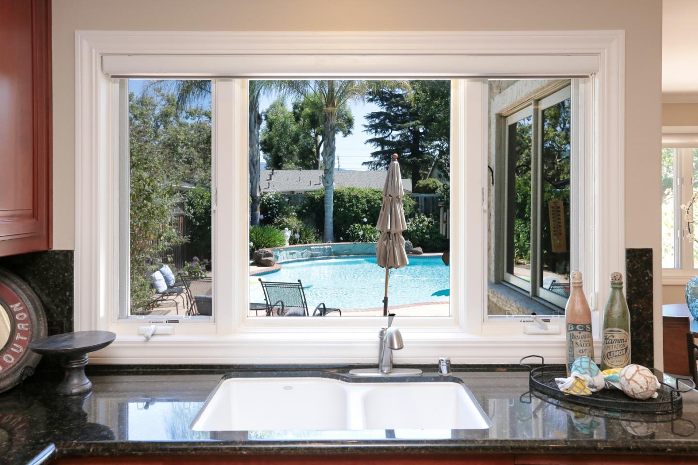 1068 Audrey Avenue Campbell, CA 95008 - Photo 8 of 47 a kitchen with a large window and a sink